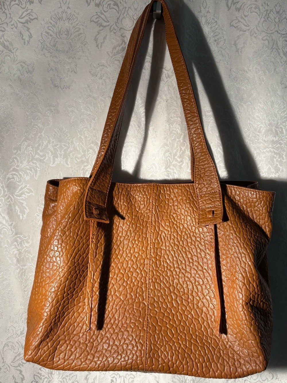 HOBO Pebbled Leather Shoulder Tote in Cognac